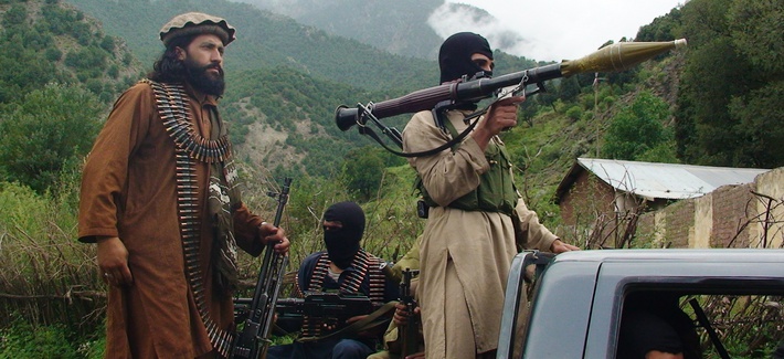 Pakistani Taliban patrol in the tribal region of South Waziristan on August 5, 2012. Pakistani Taliban patrol in the tribal region of South Waziristan on August 5, 2012.