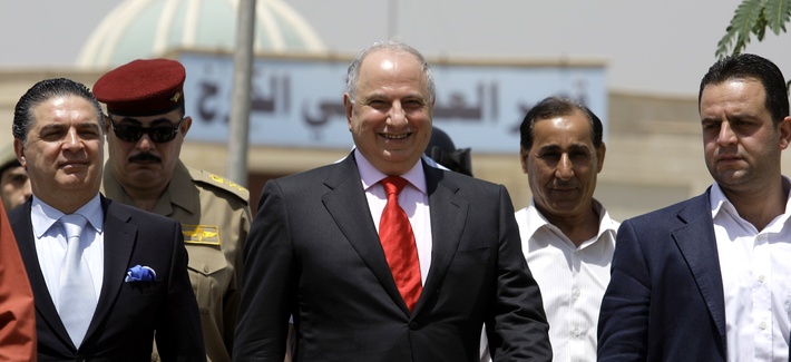 Ahmed Chalabi exits a courthouse flanked by security guards in Baghdad, Iraq, on May 12, 2009. Ahmed Chalabi exits a courthouse flanked by security guards in Baghdad, Iraq, on May 12, 2009.