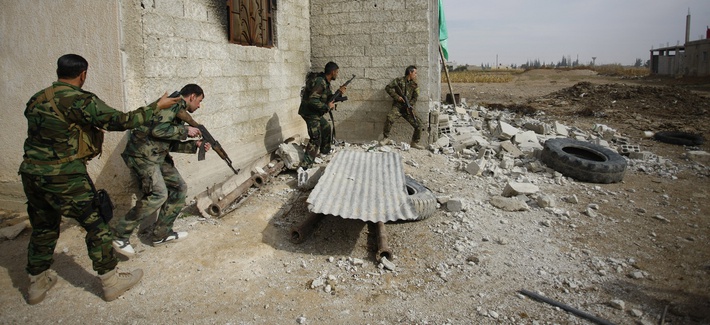 Iraqi and Lebanese Shiite fighters in the Hussein Brigade look for members of the Free Syrian Army in Damascus, Syria, on November 22, 2013. Iraqi and Lebanese Shiite fighters in the Hussein Brigade look for members of the Free Syrian Army in Damascus, Syria, on November 22, 2013.