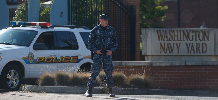 Navy security stands watch at the Washington Navy Yard, Sept. 19, 2013. The Washington Navy Yard began returning to nearly normal operations three days after it was the scene of a mass shooting in which a gunman killed 12 people. Navy security stands watch at the Washington Navy Yard, Sept. 19, 2013. The Washington Navy Yard began returning to nearly normal operations three days after it was the scene of a mass shooting in which a gunman killed 12 people.