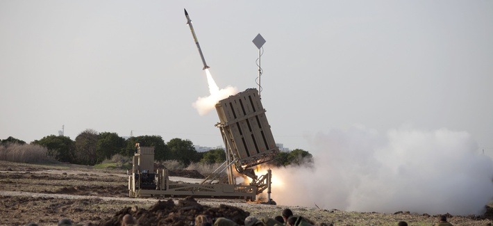 Israeli soldiers take cover as an Iron Dome battery fires a rocket near the city of Ashrod, on November 19, 2012. Israeli soldiers take cover as an Iron Dome battery fires a rocket near the city of Ashrod, on November 19, 2012.