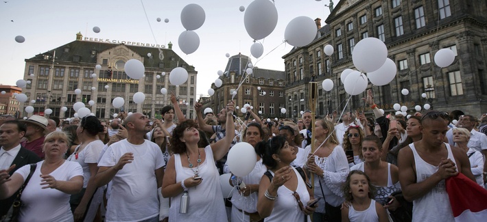 People attend a silent march of remembrance in Amsterdam for the victims of the Malaysia Airlines Flight 17 crash. People attend a silent march of remembrance in Amsterdam for the victims of the Malaysia Airlines Flight 17 crash.