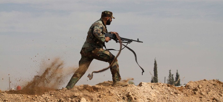 An Iraqi Shiite fighter clashes with members of the Sunni Free Syrian Army in Hatita, on November 22, 2013. An Iraqi Shiite fighter clashes with members of the Sunni Free Syrian Army in Hatita, on November 22, 2013.