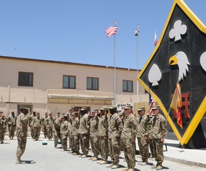 An Army colonel administers a reenlistment oath to soldiers assigned to Task Force Lifeliner at Bagram Airfield. 