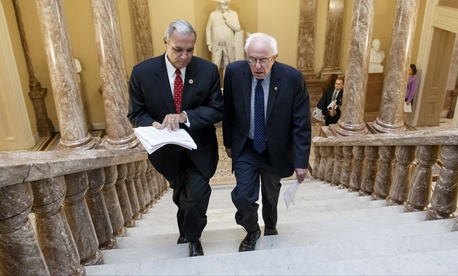 Senate Veterans’ Affairs Committee Chairman Sen. Bernie Sanders, I-Vt., right and House Veterans’ Affairs Committee Chairman Rep. Jeff Miller, R-Fla., head to a news conference on Capitol Hill on Monday.