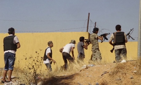 An Islamist Misarata brigade fires at a rival militia towards Tripoli Airport, on July 26, 2014.