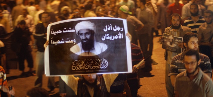 Egyptian Salafis hold posters of former al-Qaeda leader Osama Bin Laden in front of security headquarters in Cairo, Egypt. Egyptian Salafis hold posters of former al-Qaeda leader Osama Bin Laden in front of security headquarters in Cairo, Egypt.