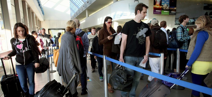 Travelers at Los Angeles International Airport prepare to check in before their flights on Thanksgiving Day 2009. Travelers at Los Angeles International Airport prepare to check in before their flights on Thanksgiving Day 2009.