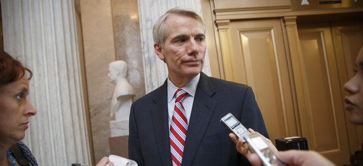 Sen. Rob Portman, R-Ohio, center, speaks with reporters at the Capitol in Washington, Monday, May 12, 2014. (AP Photo) Sen. Rob Portman, R-Ohio, center, speaks with reporters at the Capitol in Washington, Monday, May 12, 2014. (AP Photo)