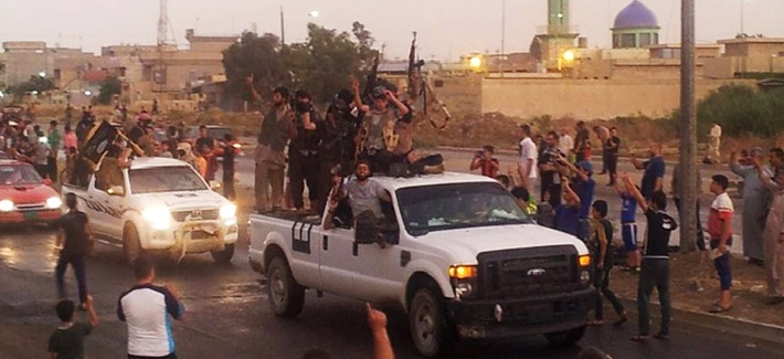 Militants with the Islamic State of Iraq and the Levant parade in the northern city of Mosul, Iraq, on June 25, 2014. Militants with the Islamic State of Iraq and the Levant parade in the northern city of Mosul, Iraq, on June 25, 2014.