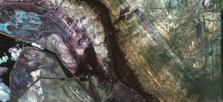 Undated file photo of the city of Al-Basra, Iraq - which borders Iran, a former wetland has been drained and walled off. Now littered with minefields and gun emplacements, it is a staging area for military exercises. Undated file photo of the city of Al-Basra, Iraq - which borders Iran, a former wetland has been drained and walled off. Now littered with minefields and gun emplacements, it is a staging area for military exercises.