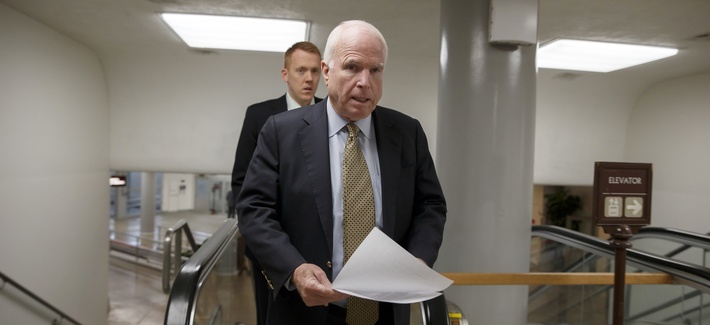 Sen. John McCain, R-Ariz., heads to the chamber to advance a bill in the Senate, on March 24, 2014. Sen. John McCain, R-Ariz., heads to the chamber to advance a bill in the Senate, on March 24, 2014.