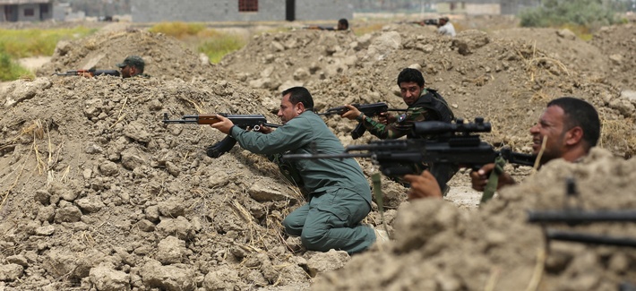 Iraqi Shiite fighters prepare to fight ISIL militants in Jurf al-Sakhar, on Monday. Iraqi Shiite fighters prepare to fight ISIL militants in Jurf al-Sakhar, on Monday.