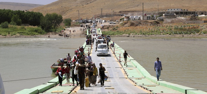 Displaced Iraqis from the Yazidi community arrive at Nowruz camp, in Derike, Syria, on August 10, 2014. Displaced Iraqis from the Yazidi community arrive at Nowruz camp, in Derike, Syria, on August 10, 2014.