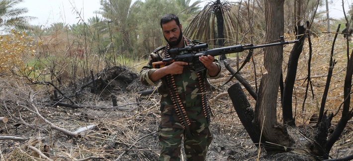 An Iraqi Shiite fighter clashes with Islamic State militants in Jurf al-Sakhar, 43 miles south of Baghdad, on August 18, 2014. An Iraqi Shiite fighter clashes with Islamic State militants in Jurf al-Sakhar, 43 miles south of Baghdad, on August 18, 2014.