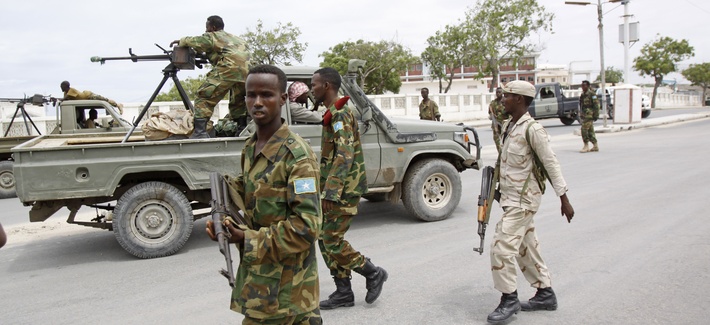 Somali government soldiers patrol during an attack on the country's parliament in Mogadishu on May 24, 2014. Somali government soldiers patrol during an attack on the country's parliament in Mogadishu on May 24, 2014.