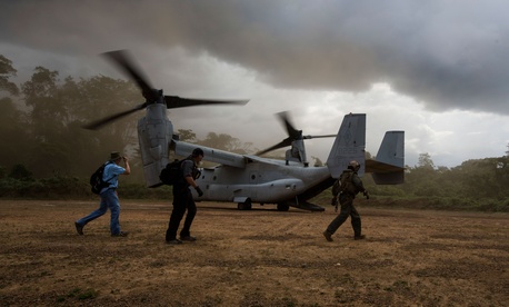 An MV-22 Osprey with the SPMAGTF Crisis Response - Africa, drops off supplies to support Operation United Assistance, in Fish Town, Liberia. An MV-22 Osprey with the SPMAGTF Crisis Response - Africa, drops off supplies to support Operation United Assistance, in Fish Town, Liberia.