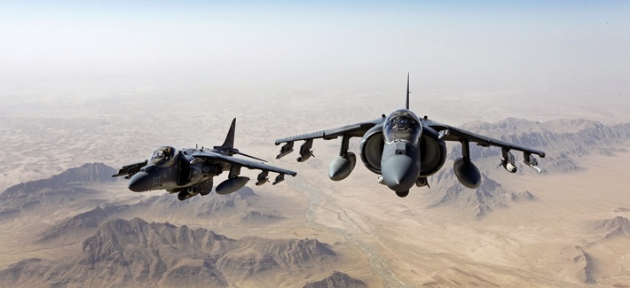 Two AV-8B Harrier jets with Marine Attack Squadron 311 fly over Helmand province, Afghanistan, on June 10, 2013