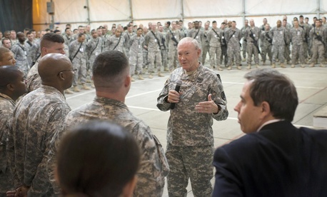U.S. Chairman of the Joint Chiefs of Staff, Army Gen. Martin E. Dempsey addresses questions from U.S. military members during a town hall meeting in Baghdad, Iraq, Nov. 15, 2014. 