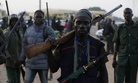 Vigilantes and local hunters armed with locally made guns gather before they go on patrol in Yola, Nigeria, Wednesday, Nov. 25, 2014. 