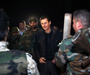 Syrian President Bashar al Assad speaks with troops on the front lines in Damascus, Syria, on January 1, 2015. Syrian President Bashar al Assad speaks with troops on the front lines in Damascus, Syria, on January 1, 2015.