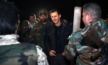 Syrian President Bashar al Assad speaks with troops on the front lines in Damascus, Syria, on January 1, 2015. Syrian President Bashar al Assad speaks with troops on the front lines in Damascus, Syria, on January 1, 2015.