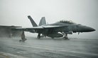 Sailors conduct pre-flight checks on an F/A-18F Super Hornet assigned to Strike Fighter Squadron 41, aboard the USS John C. Stennis, on Sept. 12, 2011.