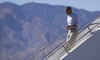 President Obama steps off Air Force One after arriving at Palm Spring International airport, on Feb. 14, 2015.