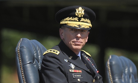 Then ISAF Commander Gen. David Petraeus participates in a retirement ceremony at Joint Base Myer-Henderson Hall in Arlington, VA, on Aug. 31. 2011.