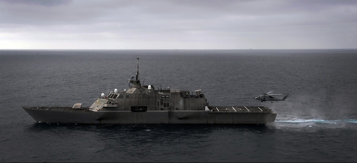 An MH-60R Sea Hawk helicopter assigned to Helicopter Maritime Strike Squadron (HSM) 77 prepares to land aboard the littoral combat ship USS Freedom, on June 7, 2011.