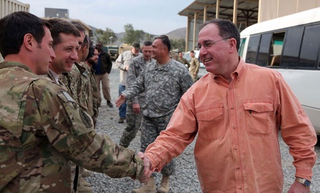 Michael Vickers, then-acting undersecretary of Defense for Intelligence and the Assistant Secretary of Defense, greets U.S. Special Forces soldiers from Special Operations Task Force East on Forward Operating Base Salerno, Khowst province, Afghanistan.