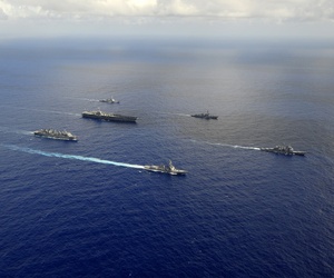 Seen here, ships from the John C. Stennis Carrier Strike Group are underway in the western Pacific Ocean. Seen here, ships from the John C. Stennis Carrier Strike Group are underway in the western Pacific Ocean.