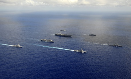Seen here, ships from the John C. Stennis Carrier Strike Group are underway in the western Pacific Ocean. Seen here, ships from the John C. Stennis Carrier Strike Group are underway in the western Pacific Ocean.