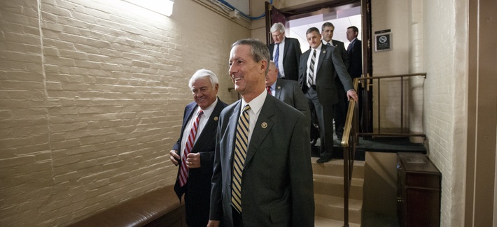 Rep. Mac Thornberry, R-Texas, center, and other House Republicans emerge from a closed-door meeting in the basement of the Capitol, on Feb. 26, 2015.