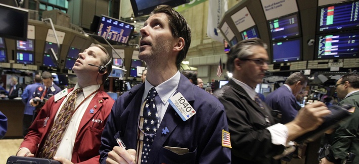 In this May 7, 2010, file photo traders work on the floor of the New York Stock Exchange in New York, following a flash crash. 