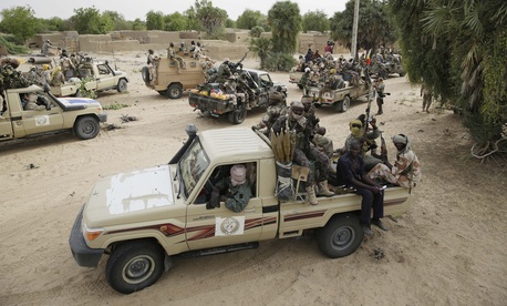 Chadian soldiers escorting a group of journalists ride on trucks and pickups in the city of Damasak, Nigeria, Wednesday March 18, 2015. Chadian soldiers escorting a group of journalists ride on trucks and pickups in the city of Damasak, Nigeria, Wednesday March 18, 2015.