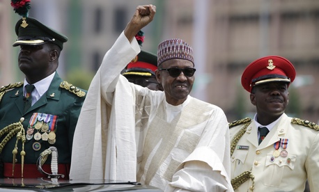 New Nigerian President, Muhammadu Buhari, salutes his supporters during his Inauguration in Abuja, Nigeria, Friday, May 29, 2015. New Nigerian President, Muhammadu Buhari, salutes his supporters during his Inauguration in Abuja, Nigeria, Friday, May 29, 2015.