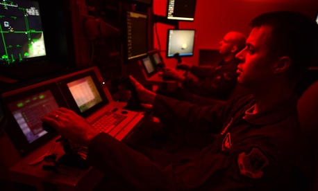 First Lt. Kyle, 91st Attack Squadron pilot, and Tech. Sgt. Jason, 91st ATKS sensor operator, fly a simulated training mission on an MQ-9 Reaper at Creech Air Force Base, Nev., May 8, 2014. First Lt. Kyle, 91st Attack Squadron pilot, and Tech. Sgt. Jason, 91st ATKS sensor operator, fly a simulated training mission on an MQ-9 Reaper at Creech Air Force Base, Nev., May 8, 2014.