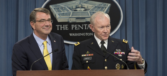 Secretary of Defense Ash Carter and Army Gen. Martin E. Dempsey, chairman of the Joint Chiefs of Staff, brief reporters during a news conference at the Pentagon July 1, 2015.