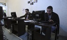 In this picture taken on Tuesday, Jan. 18, 2011, Iranian journalism students use computers in an internet cafe in central Tehran, Iran.