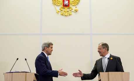 Russian Foreign Secretary Sergey Lavrov, right, and U.S. Secretary of State John Kerry, shake hands during a news conference at the presidential residence of Bocharov Ruchey in Sochi, Russia, Tuesday May 12, 2015. 