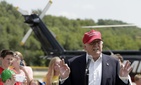 Republican presidential candidate Donald Trump talks to the media after arriving by helicopter at a nearby ballpark before Trump attended the Iowa State Fair Saturday, Aug. 15, 2015, in Des Moines.