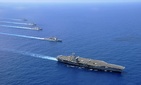 Aircraft carrier USS Nimitz, guided-missile cruiser USS Chosin, guided-missile destroyers USS Sampson and USS Pinkney, and guided-missile frigate USS Rentz operate in formation in the South China Sea.