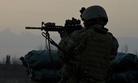 A U.S. Army military information support operations sergeant with Special Operations Task Force-South provides security overwatch in Kandahar province's Zharay District in Afghanistan in 2011.