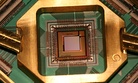A quantum computing processor from the company D Wave, the Washington C16.