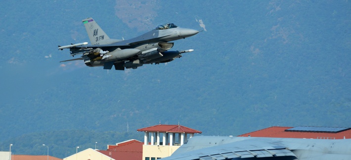 A USAF F-16 Fighting Falcon accompanies about 300 airmen and cargo from Aviano Air Base, Italy, to Incirlik Air Base, Turkey, in support of Operation Inherent Resolve on Aug. 9, 2015. 