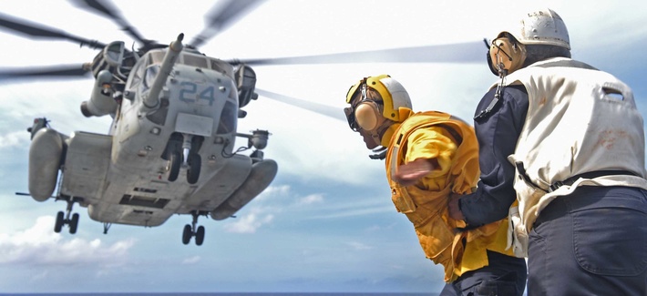 In the Pacific Ocean, a CH-53E Super Stallion lifts off the flight deck of the amphibious dock landing ship USS Ashland (LSD 48), Aug. 17, 2015.