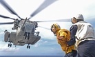 In the Pacific Ocean, a CH-53E Super Stallion lifts off the flight deck of the amphibious dock landing ship USS Ashland (LSD 48), Aug. 17, 2015.