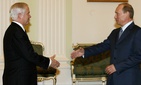 U.S. Defense Secretary Robert Gates and Russian President Vladimir Putin, right, smile and shake hands in Moscow's Kremlin on Monday, April 23, 2007.