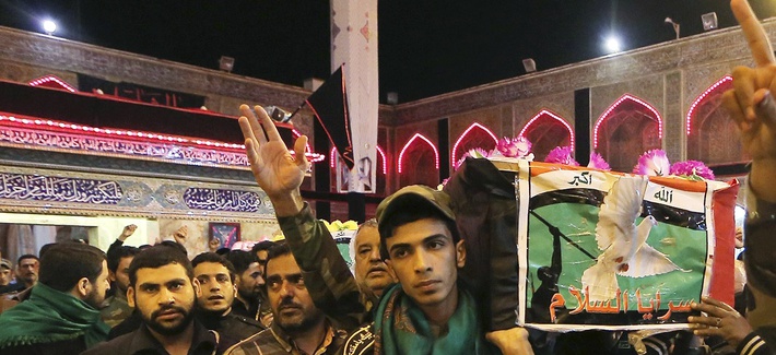 Iraqi fighters of the Peace Brigades, a Shiite militia group loyal to cleric Muqtada al-Sadr, angry after two of their members were killed in Ramadi during fighting with Islamic State militants, Nov. 7, 2015.